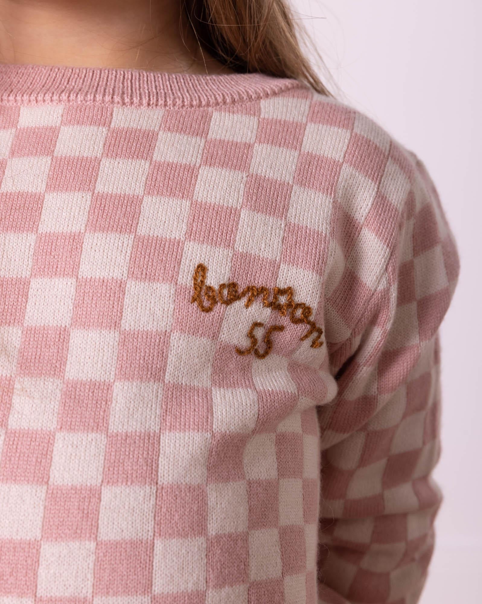 Pull damier rose en tricot jacquard